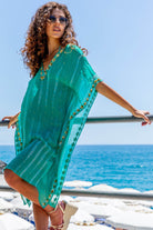aqua floaty silk kaftans to wear over swimwear y Lindsey Brown resort wear 