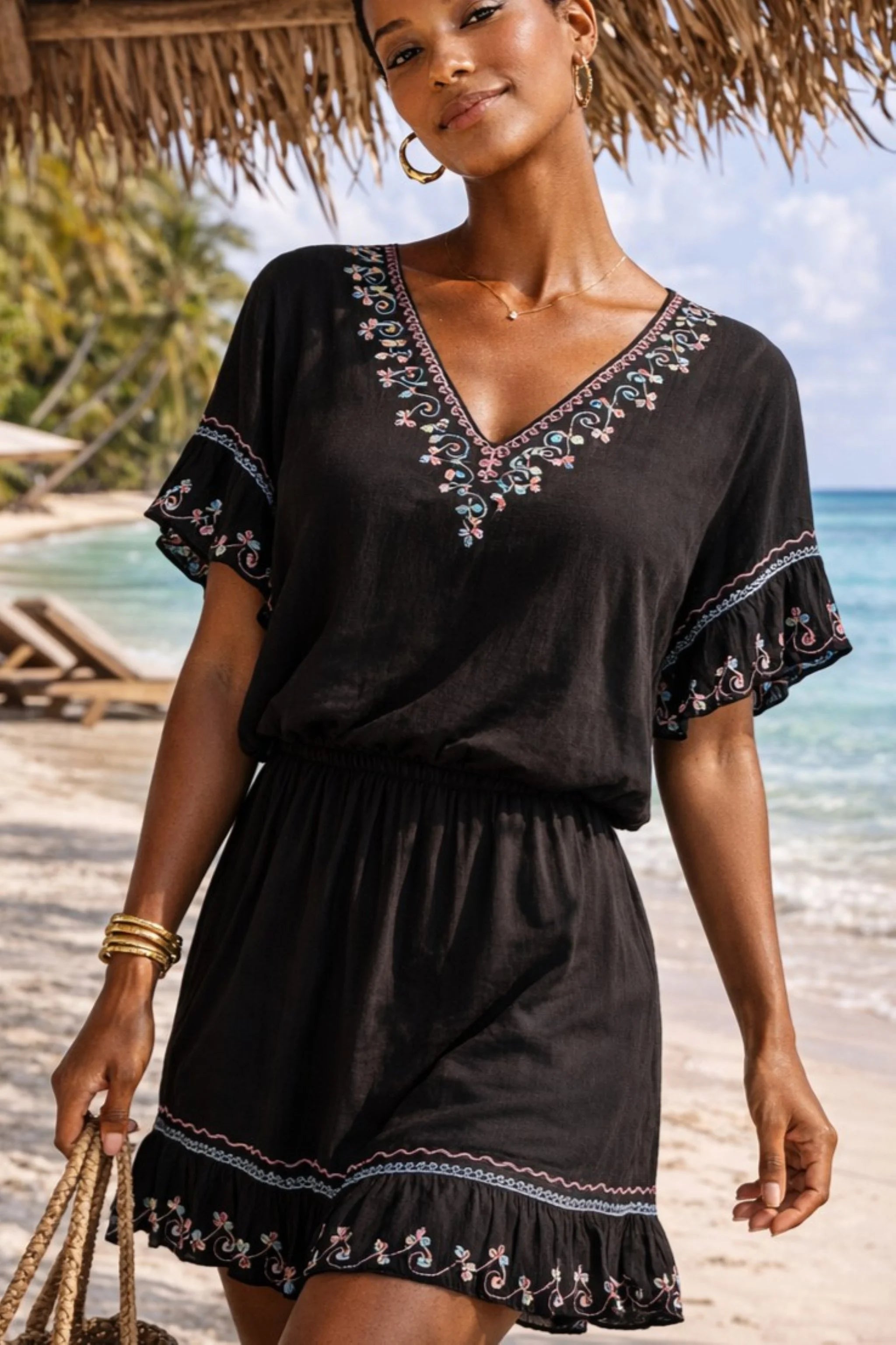 black cotton v neck beach dresses to wear on holiday with a soft elasticated waistline