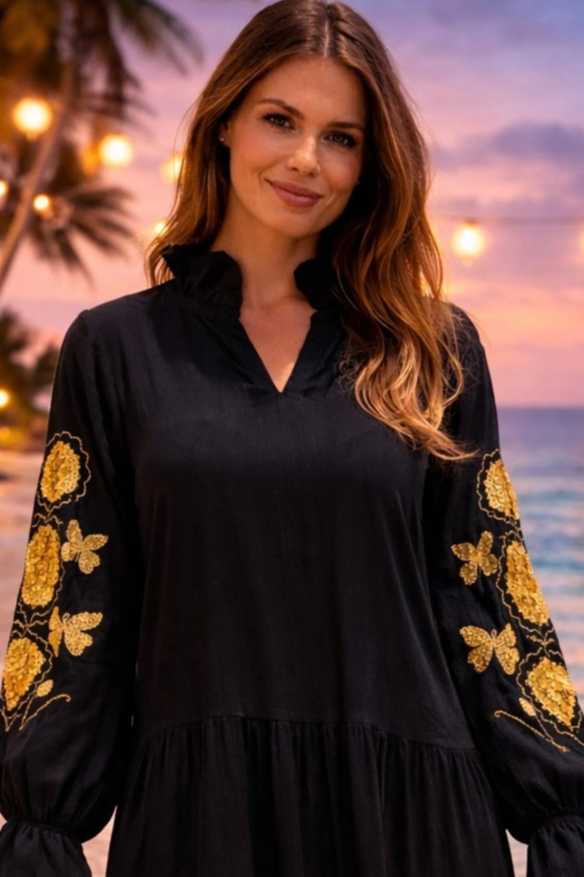 black long sleeved cotton beach dress with gold embroidery on long sleeves to wear on cooler evenings by lindsey brown resort wear