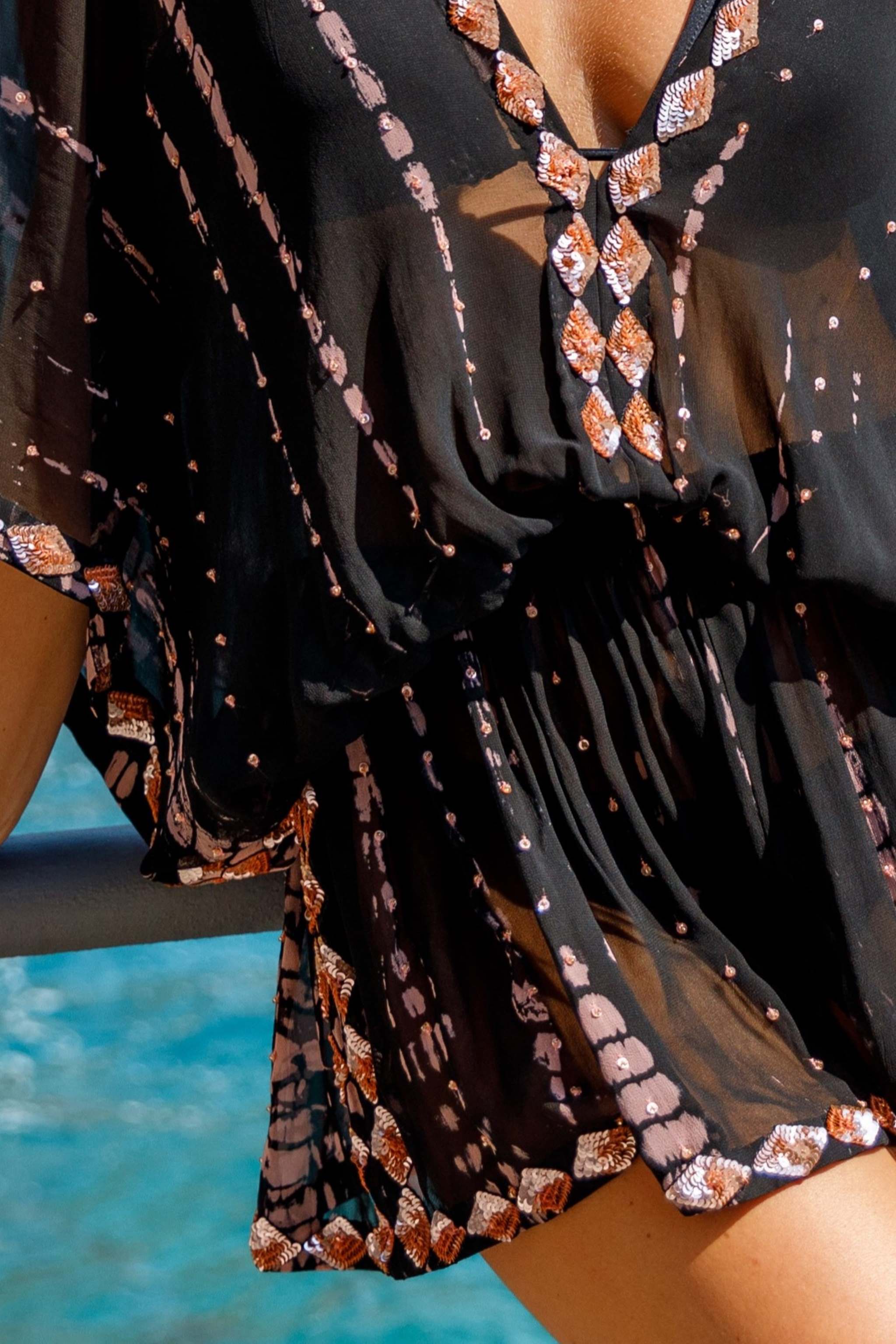 Black sequinned silk designer silk kaftans with blush pink tie dye by Lindsey Brown silk resort wear