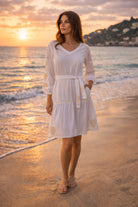 white knee length belted beach dress with gold embroidery by lindsey brown