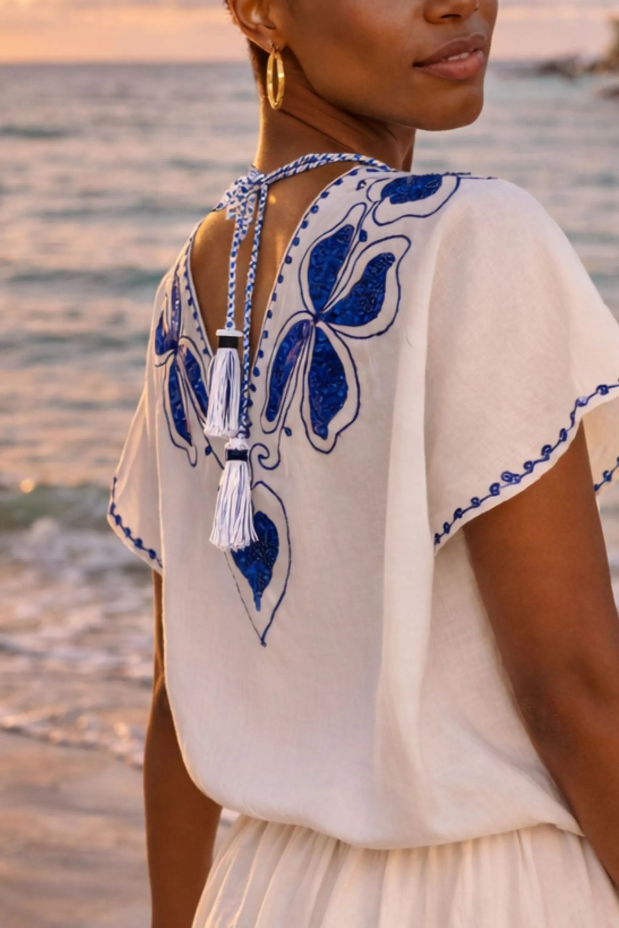 white blue low v back embroidered cotton beach dress to wear on caribbean holidays