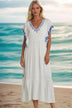 white cotton embroidered beach dresses to wear on vacation by Lindsey Brown