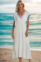 white cotton embroidered beach dresses to wear on vacation by Lindsey Brown