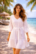 white v neck beach dresses with silver embroidery on the sleeves to wear on warm holidays 