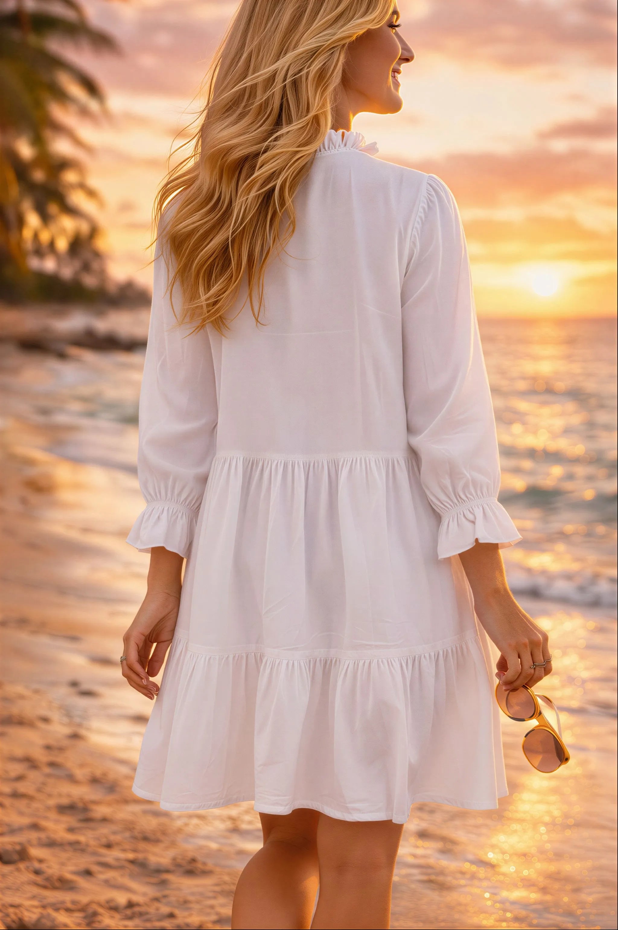 white cotton loose fitting long sleeved beach dress to wear to the beach