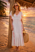 white and pink cotton beach dresses to wear on a luxury holiday by lindsey brown