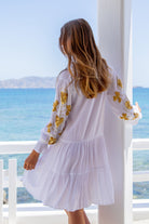 white and gold knee length beach dresses by lindsey brown resort wear