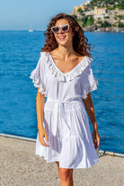 White beach dresses in soft cotton in loose and floaty cotton by Lindsey Brown 