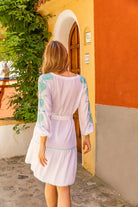White long sleeved cotton beach dress to wear on holiday by Lindsey Brown resort wear