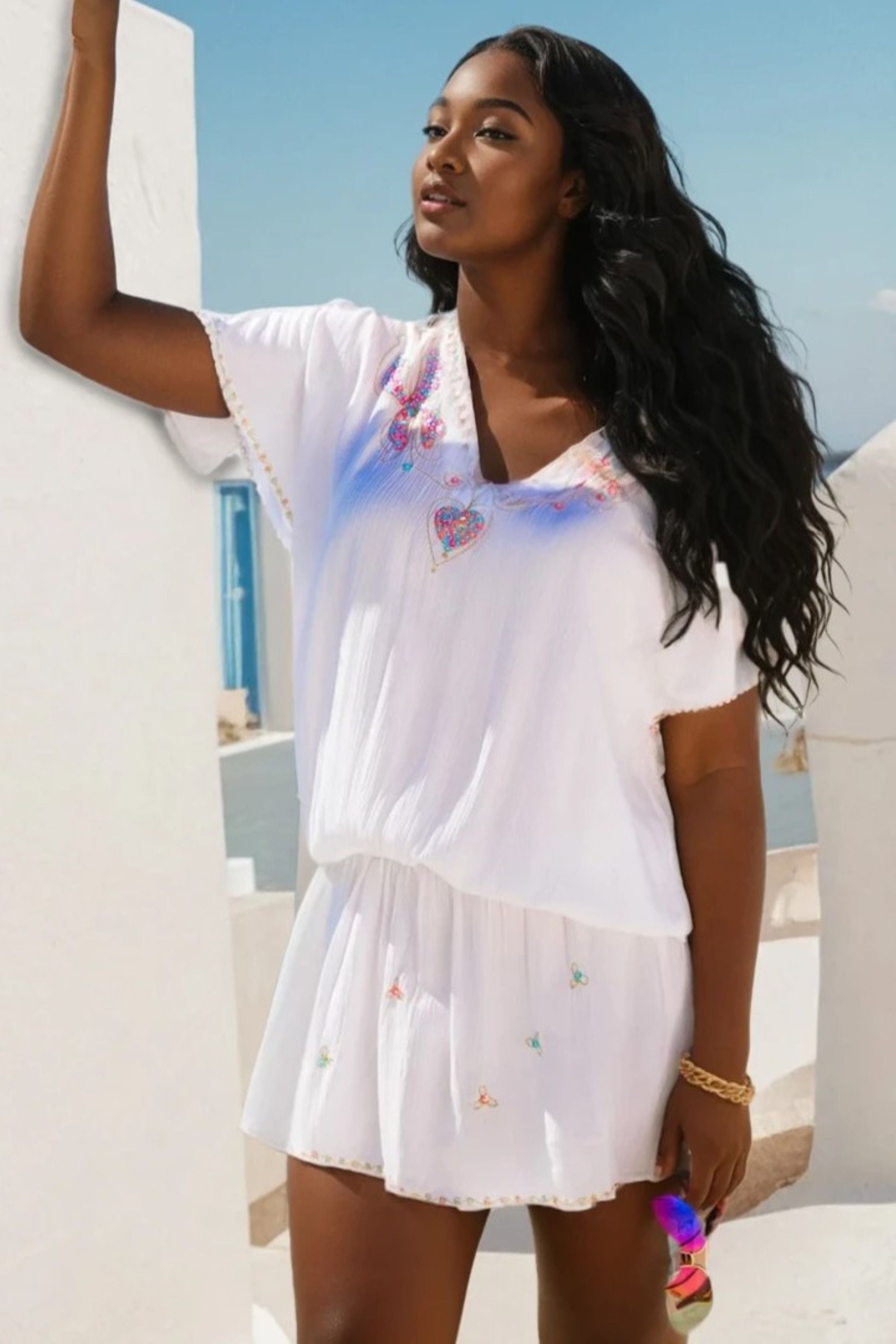 white plus size  cotton short beach dress to wear on holiday by Lindsey Brown luxury resort wear 