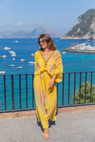 Yellow silk luxury maxi kaftans to wear on holiday by Lindsey Brown resort wear