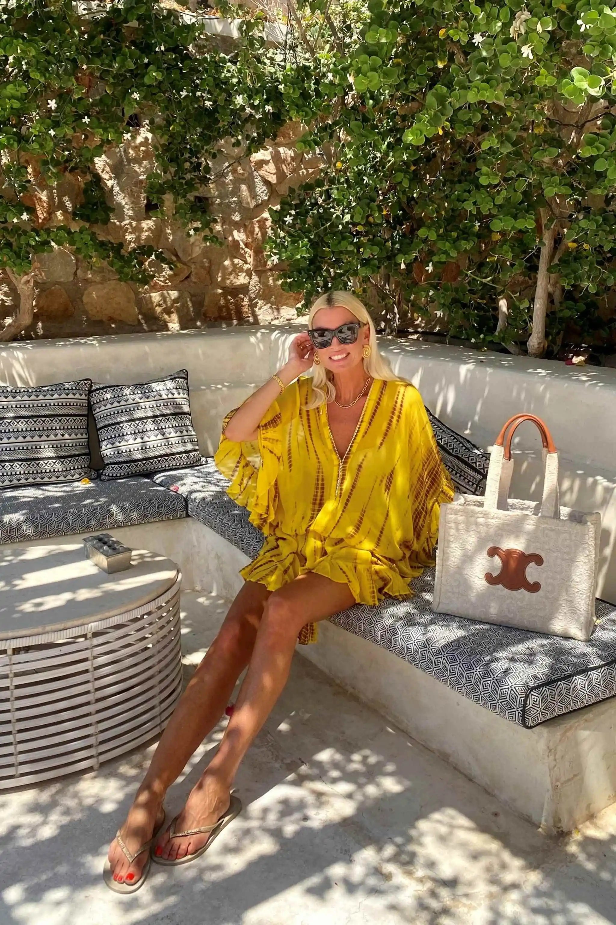 Yellow silk kaftans worn by Anna Mavridis wears Lindsey Brown